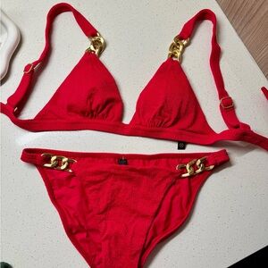 Vibrant Red Bikini with Luxurious Gold Chain Details